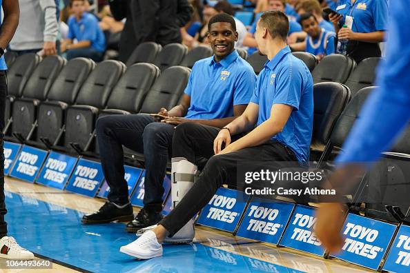 Cody Riley Cody Riley and Alex Olesinski of the UCLA Bruins sit court side... News ...