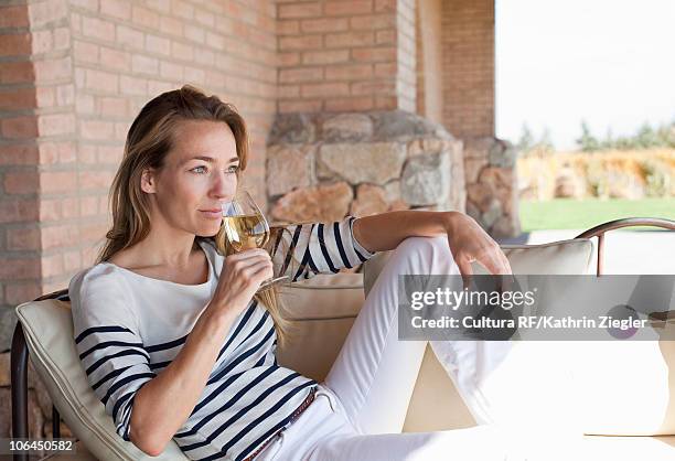 woman enjoying wine on the terrace - mendoza stock pictures, royalty-free photos & images