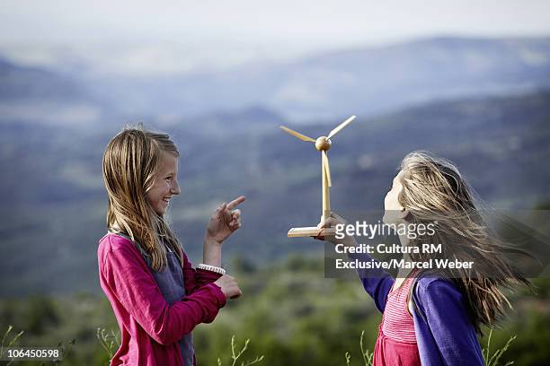 girls with miniature windmill - preteen girl models stock pictures, royalty-free photos & images