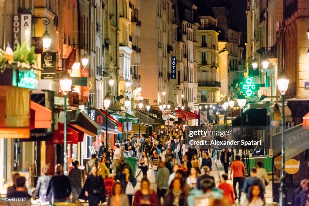 Rue Montorgueil pedestrian street with multiple restaurants and intense nightlife, Paris, France