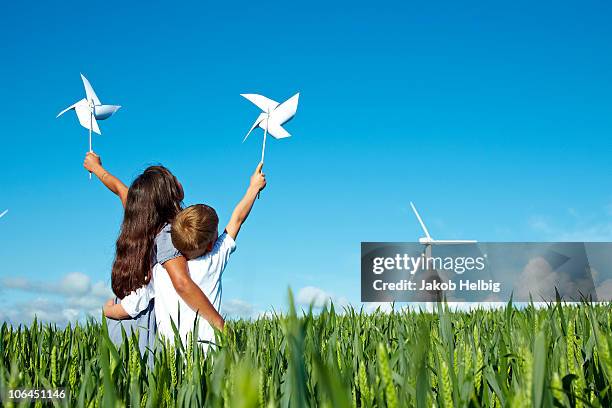 boy and girl with wind turbine - initiative stock pictures, royalty-free photos & images