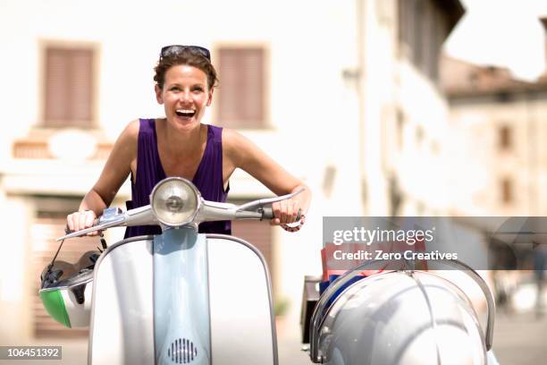 woman driving a vespa - sidecar stock pictures, royalty-free photos & images