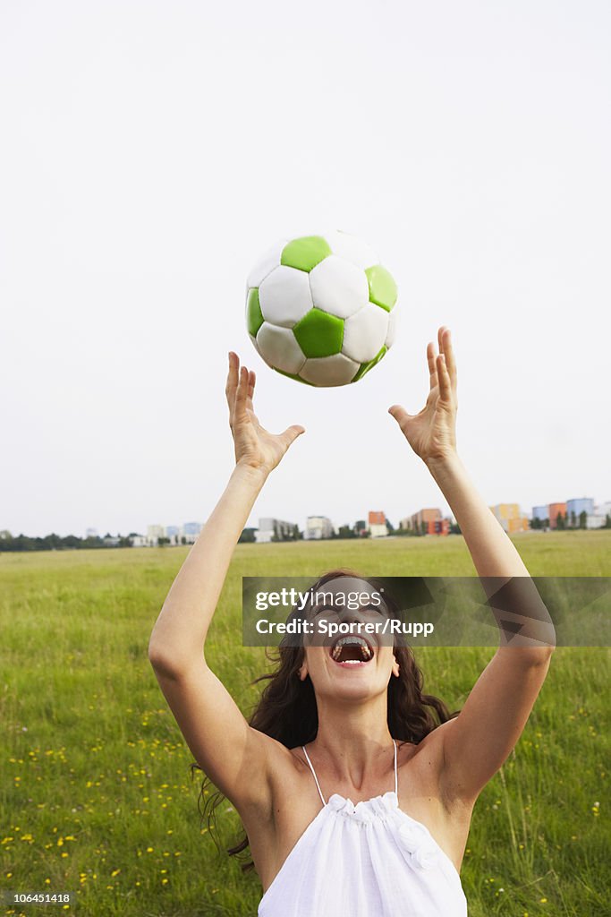 Woman catching soccer ball