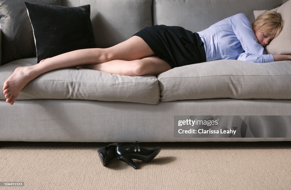 Woman sleeping on sofa