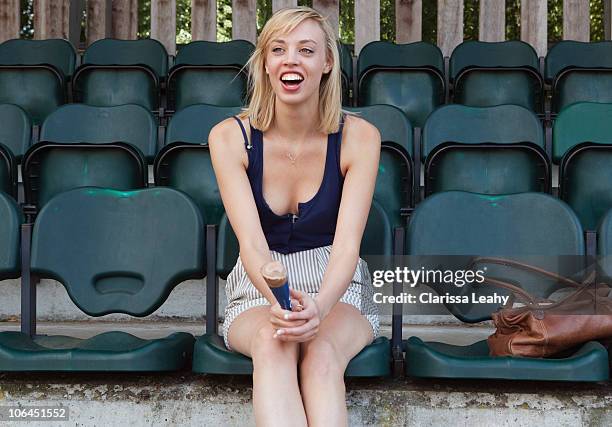 woman shouting from the stands - blonde cheering stock-fotos und bilder