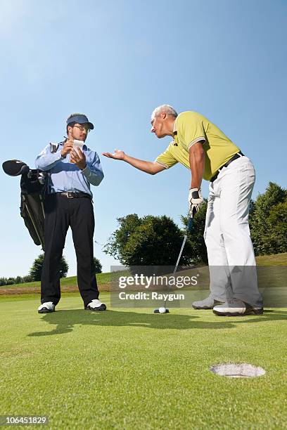 complaining about the score - course caddie stock pictures, royalty-free photos & images