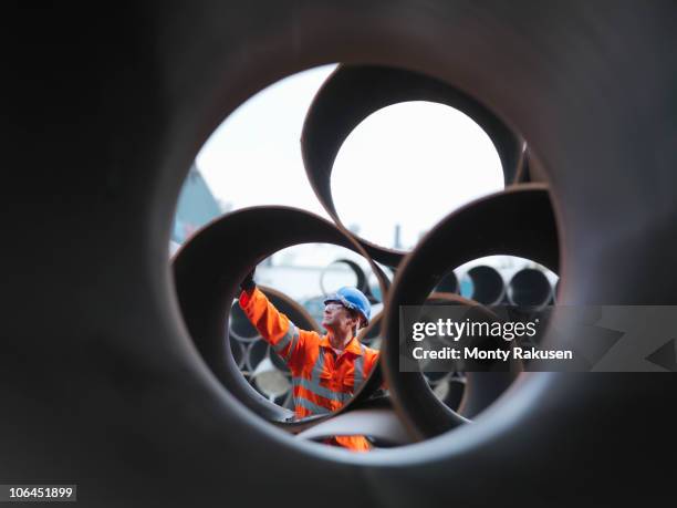 man checking pipes - pipe stock-fotos und bilder