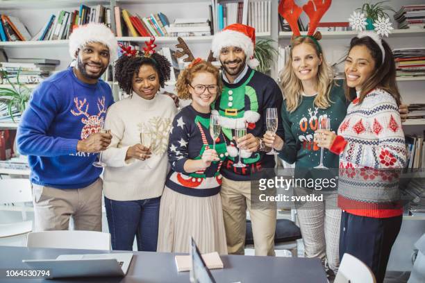 ugly sweater day in office - ugliness stock pictures, royalty-free photos & images