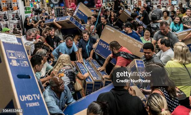 People participate in a &quot;Black Friday&quot; event in São Paulo, Brazil, on November 23, 2018. &quot;Black Friday&quot; is a term created in the...