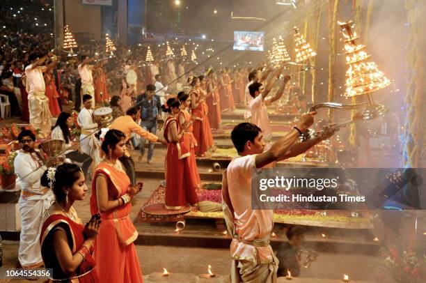 Priests perform aarti as devotees pray during Ganga Dussehra festival at Dashashwamedh Ghat on the banks of the river Ganges, on November 23, 2018 in...