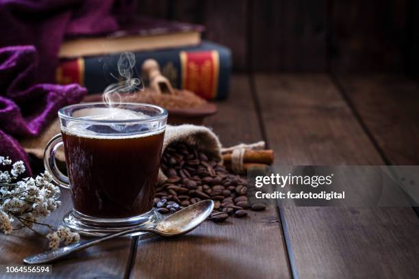 coffee backgrounds: coffee cup on rustic wooden table with copy space - coffee still life stock pictures, royalty-free photos & images