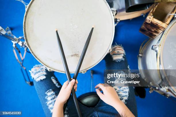 close up images of girl playing drum. - playing drums stock pictures, royalty-free photos & images