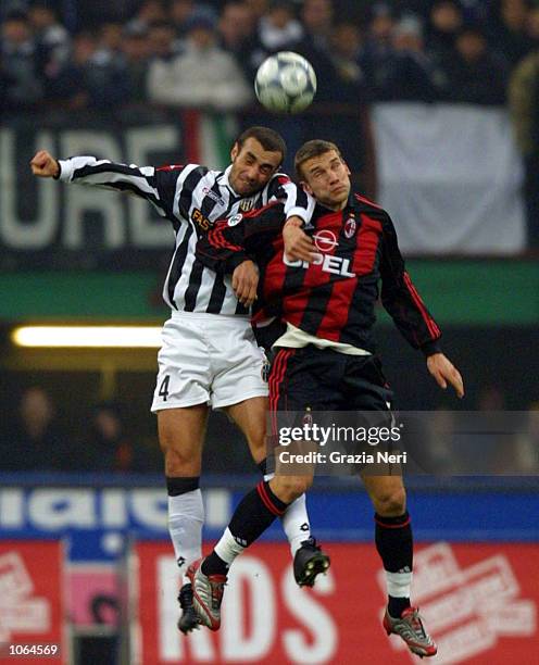 Andriy Shevchenko of AC Milan and Paolo Montero of Juventus in action during the Serie A 14th Round League match between AC Milan and Juventus played...