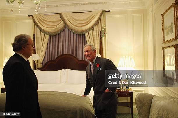 Prince Charles, the Prince of Wales checks a bed in one of the new bedrooms during the Savoy Hotels grand re-opening on November 2, 2010 in London,...