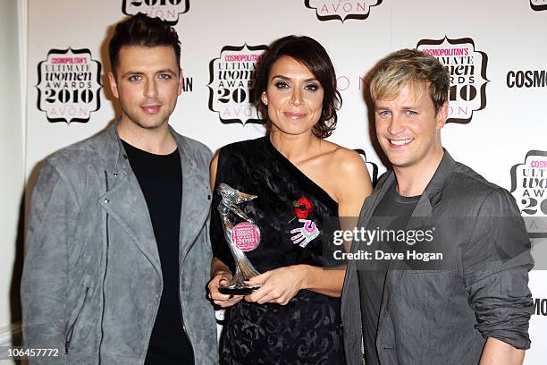 Mark Feehily and Kian Egan of Westlife pose after presenting Christine Bleakley with her Best TV Presenter award in the press room at the...