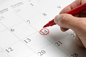 A circled date on a large calendar in red ink