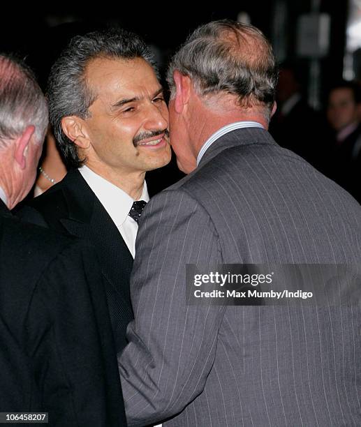 Prince Alwaleed Bin Talal Bin AbdulAziz Alsaud kisses Prince Charles, Prince of Wales as they attend the re-opening of the newly restored Savoy Hotel...