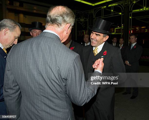 Prince Charles, Prince of Wales meets the Head Doorman as he attends the re-opening of the newly restored Savoy Hotel on November 2, 2010 in London,...