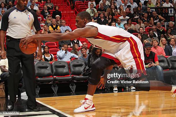 Chris Bosh of the Miami Heat saves a loose ball against the Minnesota Timberwolves on November 2, 2010 at American Airlines Arena in Miami, Florida....