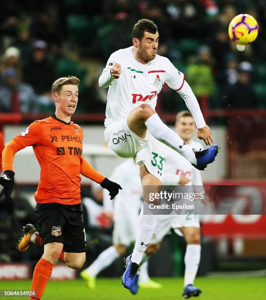 Solomon Kvirkvelia of FC Lokomotiv Moscow vies for the ball with Vladimir Ilyin of FC Ural Ekaterinburg during the Russian Premier League match...