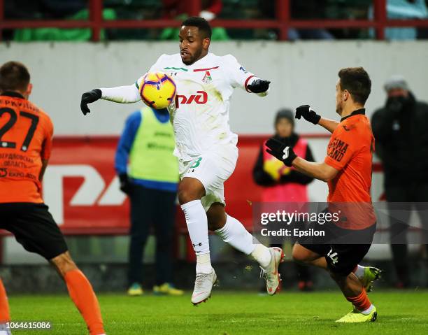 Jefferson Farfan of FC Lokomotiv Moscow vies for the ball with Yury Bavin of FC Ural Ekaterinburg during the Russian Premier League match between FC...