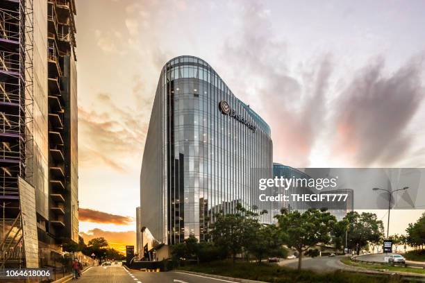 sandton city discovery building at sunset - sandton johannesburg stock pictures, royalty-free photos & images