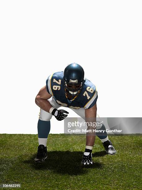 football lineman in stance. front view - american football player white background stock pictures, royalty-free photos & images