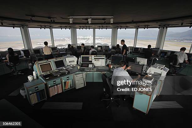 Aviation-IT-Internet-security FEATURE by Adrian Addison In a picture taken on October 13, 2010 Air Traffic Controllers monitor flight traffic in the...