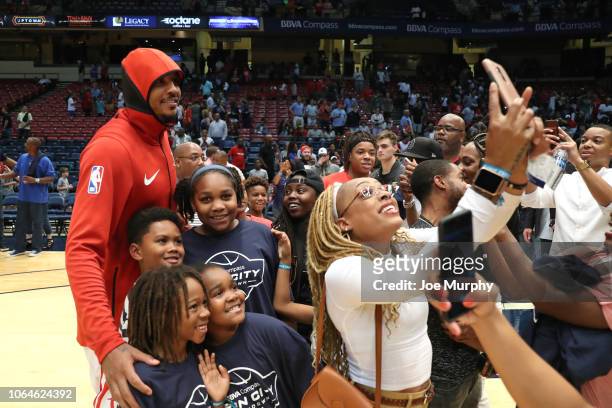 Carmelo Anthony of the Houston Rockets takes a photograph with fans before the game against the Memphis Grizzlies on October 2, 2018 at Legacy Arena...