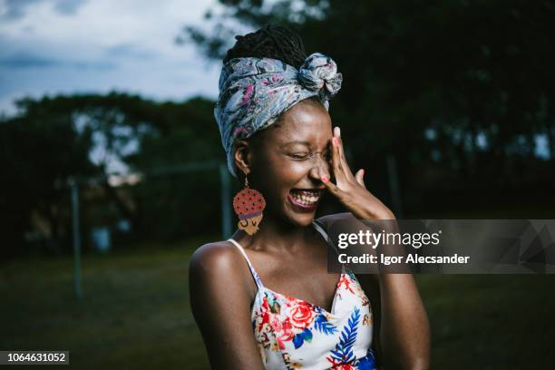 beautiful african-american young woman - female laughing face stock pictures, royalty-free photos & images