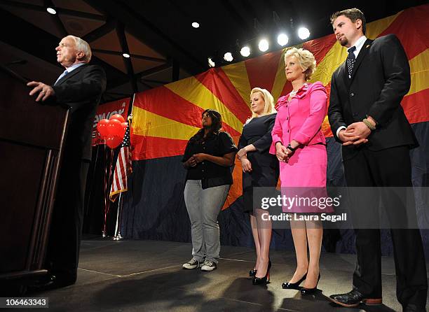 Sen. John McCain speaks to the crowd with his wife Cindy McCain and daughters Meghan McCain and Bridget McCain during an Arizona Republican Party...