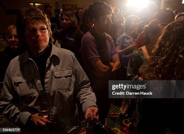 Supporters listen to Democratic candidate for Wisconsin, Russ Feingold as he concedes to Republican candidate Ron Johnson during his election night...