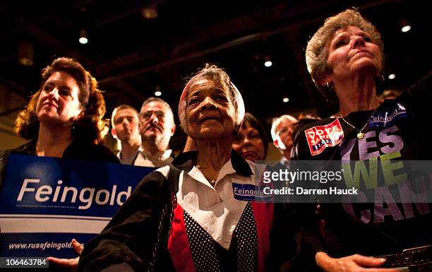 Supporters listen to Democratic candidate for Wisconsin, Russ Feingold as he concedes to Republican candidate Ron Johnson during his election night...