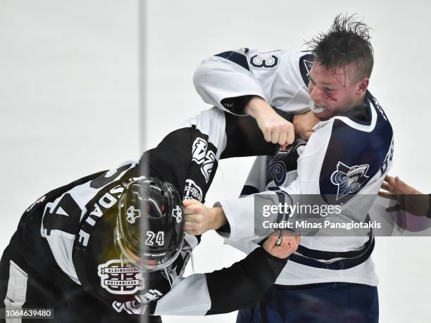Parker Bowman of the Rimouski Oceanic fights against Joel Teasdale of the Blainville-Boisbriand Armada during the QMJHL game at Centre d'Excellence...