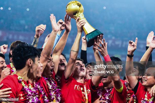 Oscar of Shanghai SIPG celebrates with teammates during the award ceremony of the 2018 Chinese Super League 29th round match between Shanghai SIPG...
