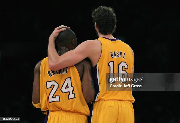Pau Gasol of the Los Angeles Lakers puts his arm around teammate Kobe Bryant during the third quarter against the Memphis Grizzlies at Staples Center...
