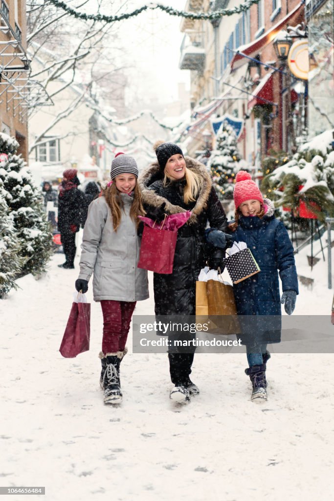 Winter shopping for mother and preteen girls.