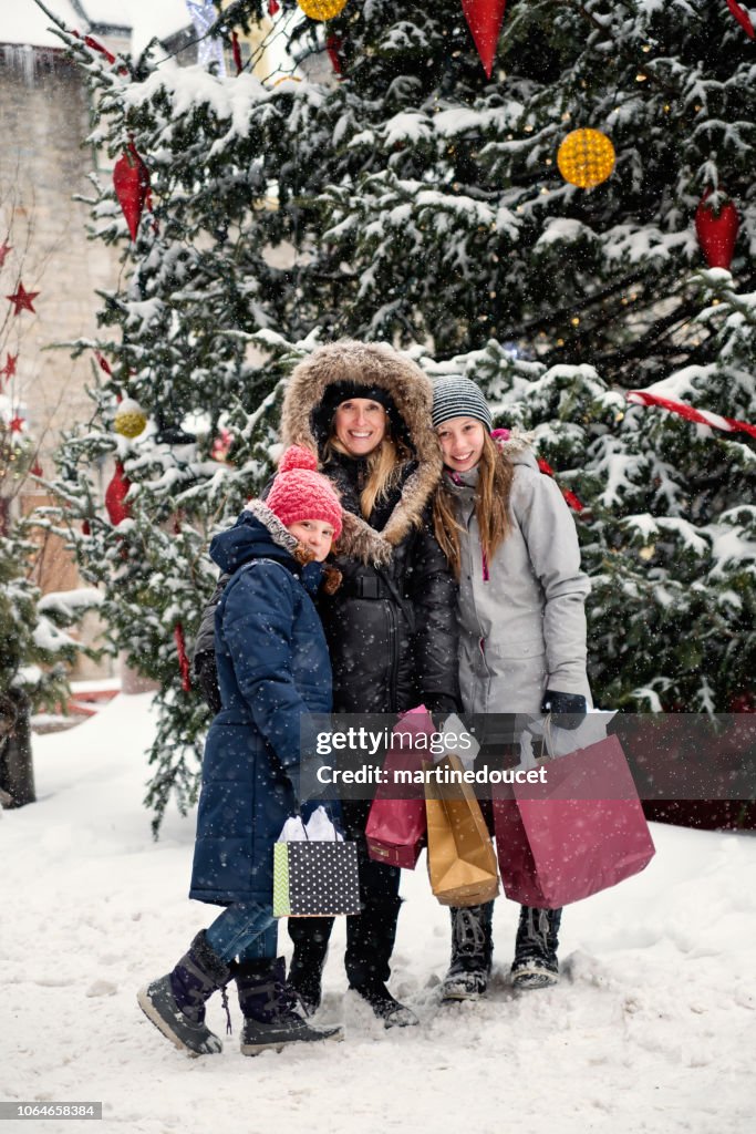 Winter shopping for mother and preteen girls.