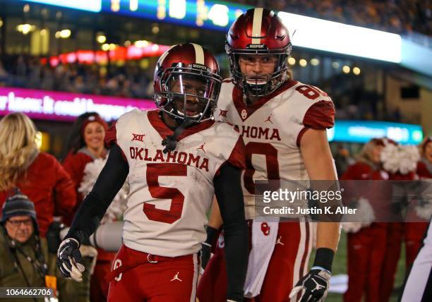Marquise Brown of the Oklahoma Sooners celebrates after catching a 45 yard touchdown pass against the West Virginia Mountaineers on November 23, 2018...