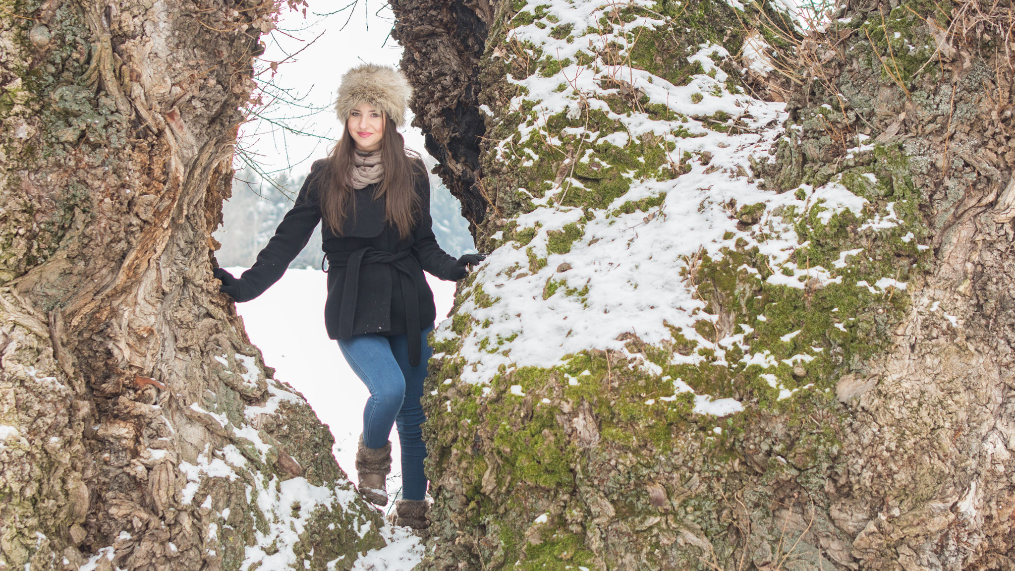 Beautiful Caucasian girl in snow near tree Beautiful Caucasian girl in snow near tree