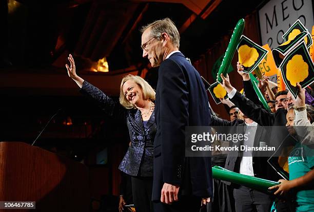 California Republican gubernatorial candidate and former eBay CEO Meg Whitman waves at supporters with her husband Dr. Griff Harsh at her side after...