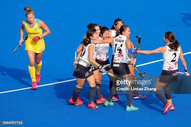 Minami Shimizu of Japan celebrates a goal with teammate during the FIH Champions Trophy match between Australia and Japan on November 22, 2018 in...
