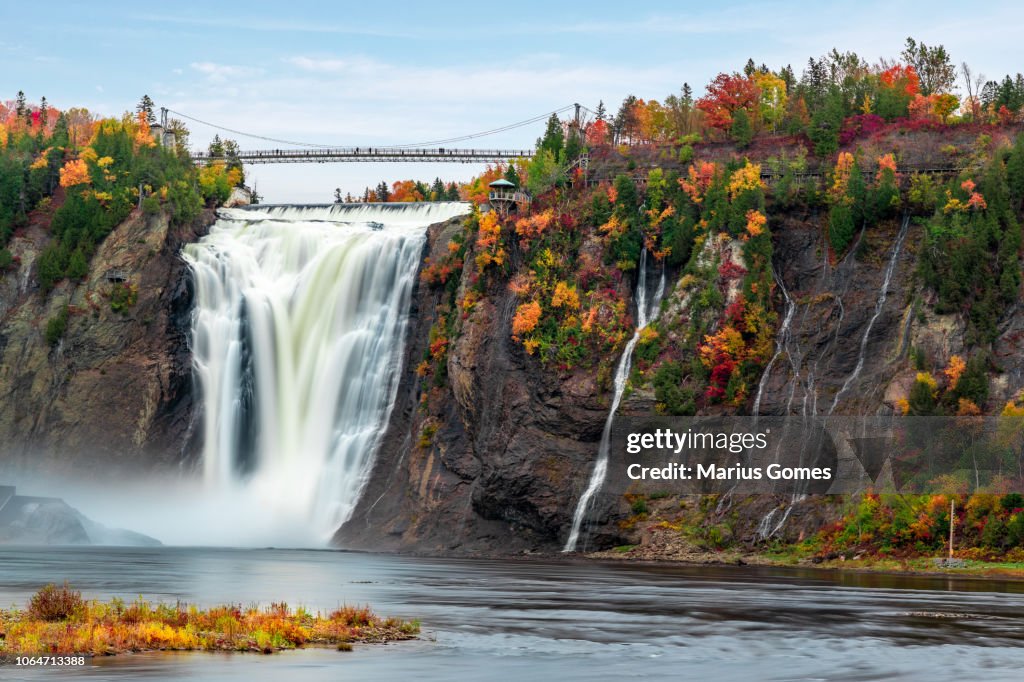 Montmorency Falls and Bridge in autumn with colorful trees