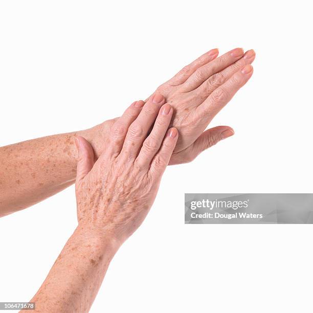 elderly hands. - old woman hand stock pictures, royalty-free photos & images