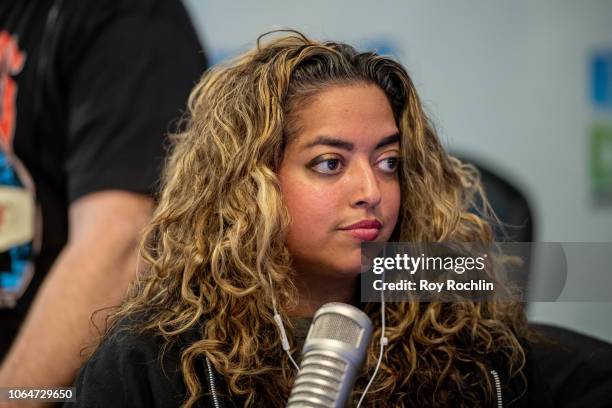 Host Medha Gandhi as The Struts visit the Elvis Duran show at Z100 Studio on November 07, 2018 in New York City.