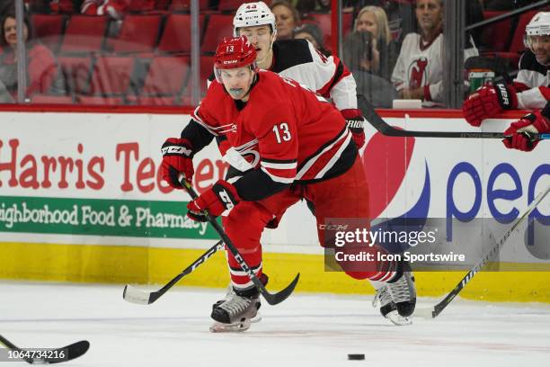 Carolina Hurricanes Left Wing Warren Foegele chess after a loose puck during a game between the Carolina Hurricanes and the New Jersey Devils at the...