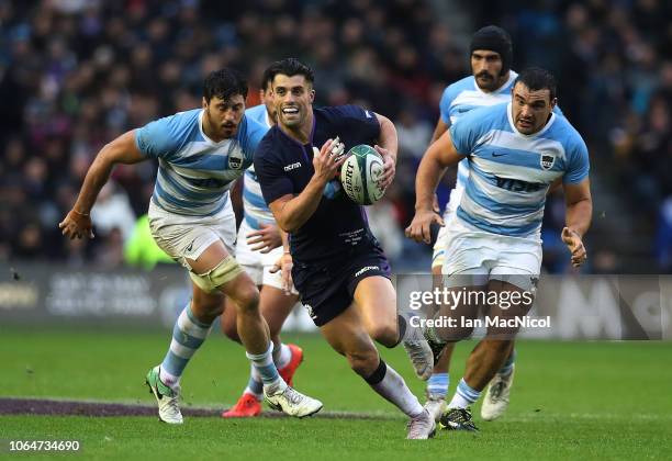 Adam Hastings of Scotland runs with the ballduring the International Friendly match between Scotland and Argentina at Murrayfield Stadium on November...