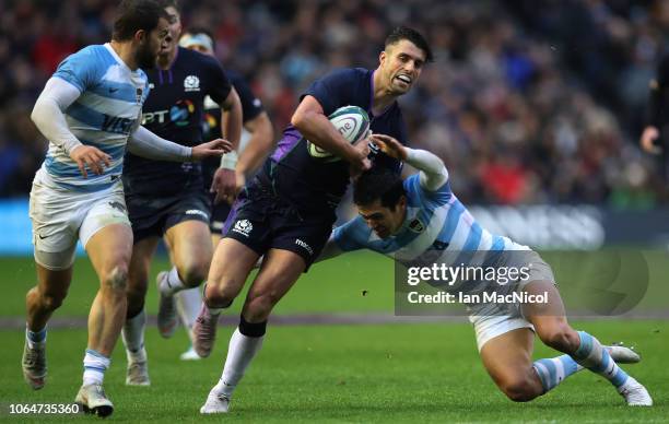 Adam Hastings of Scotland is tackled by Matias Moroni of Argentina during the International Friendly match between Scotland and Argentina at...