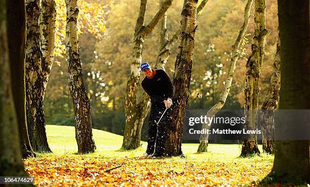 David Mortimer of Fore Ireland plays from behind the trees on the 6th hole during the first day of the Srixon PGA Playoff Final at Little Aston Golf...