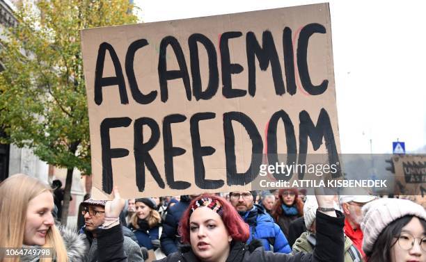 Protester holds a sign reading "Academic Freedom" in Budapest downtown on November 24, 2018 during a march to protest against the education, science...